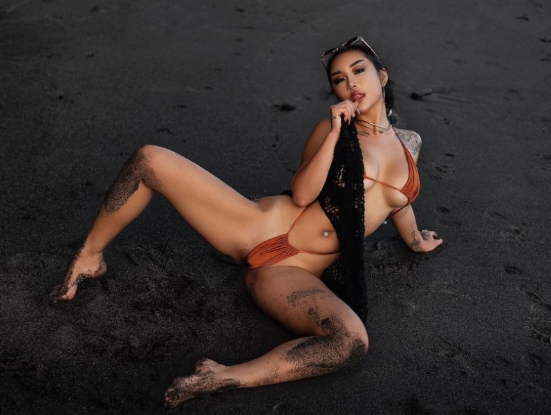 Jessica-Wolf-wearing-a-bikini-on-a-black-sand-beach